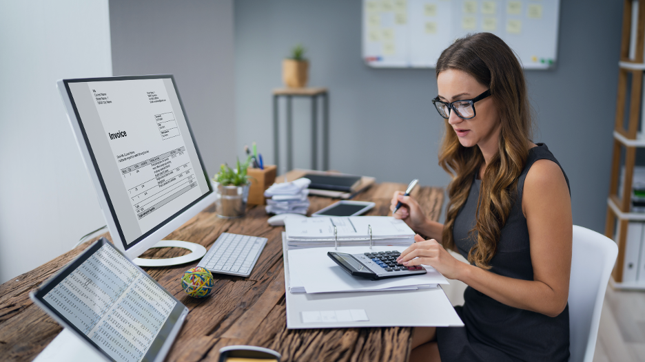 women working at her desk with the late payments
