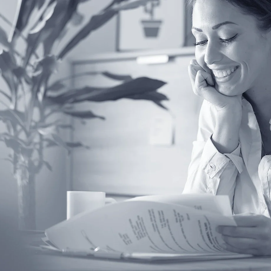 happy-female-entrepreneur-analyzing-business-reports-feeling-satisfied-about-business-progress